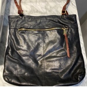 Hobo International Black purse with Brown Straps, outside zipper pocket.